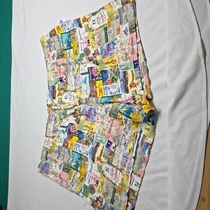 New Disney Parks 100 Disneyland memorabilia collage print shorts